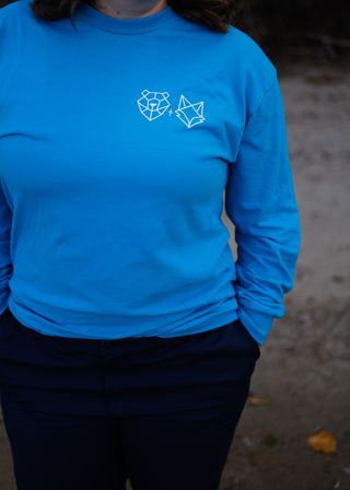 turquoise long sleeve tee made in canada on woman outside