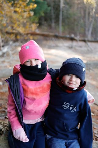 young girl wearing the black dickie huge younger brother wearing the plaid dickie on a cold day in canada