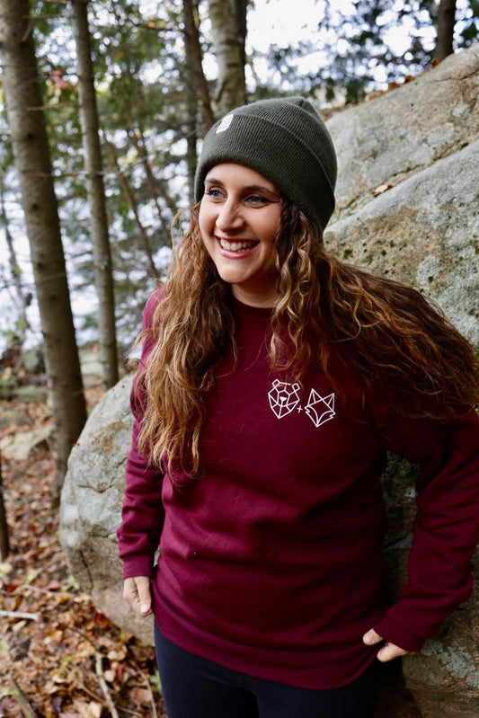 canadian woman in maroon crewneck in north by ontario