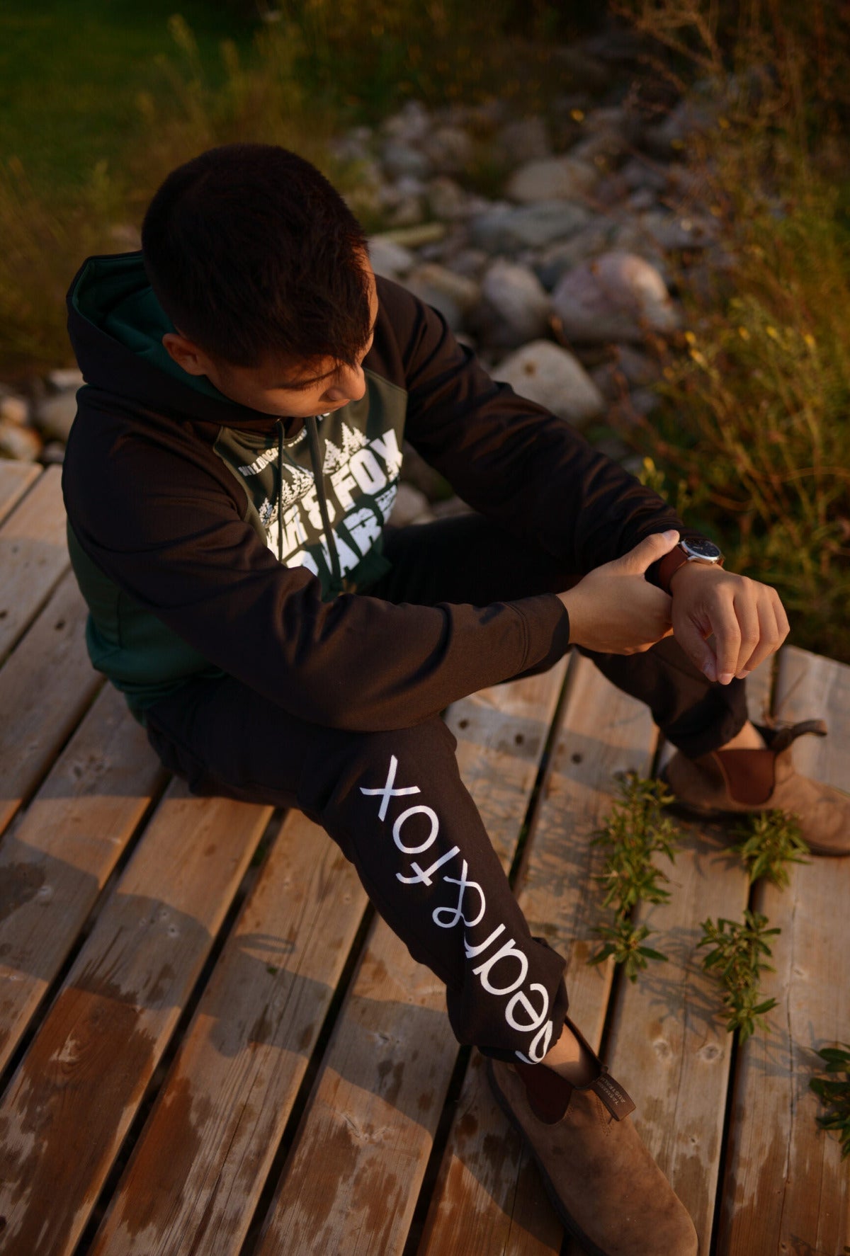 Bear and Fox Apparel Terry Fox Jogger canadian man sitting outside at the cottage goderich ontario airbnb